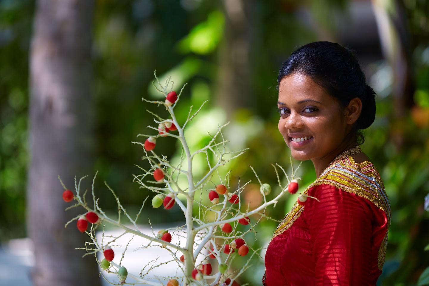 Baros Maldives - Resort - History and Culture - Maldivian Lady - With Tree.jpg