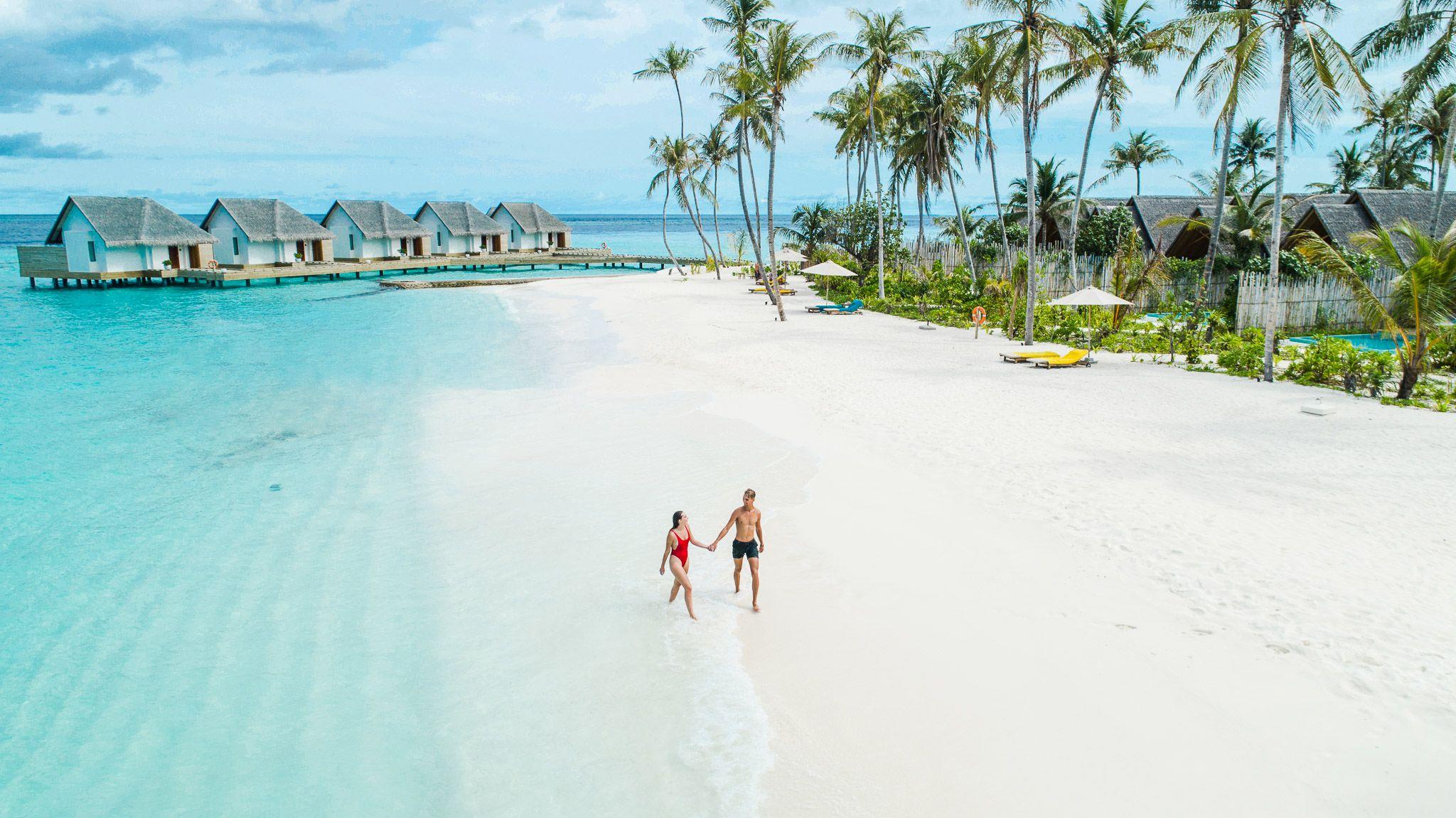 Fushifaru Maldives - Lifestyle - Couple - Beach Walk.jpg
