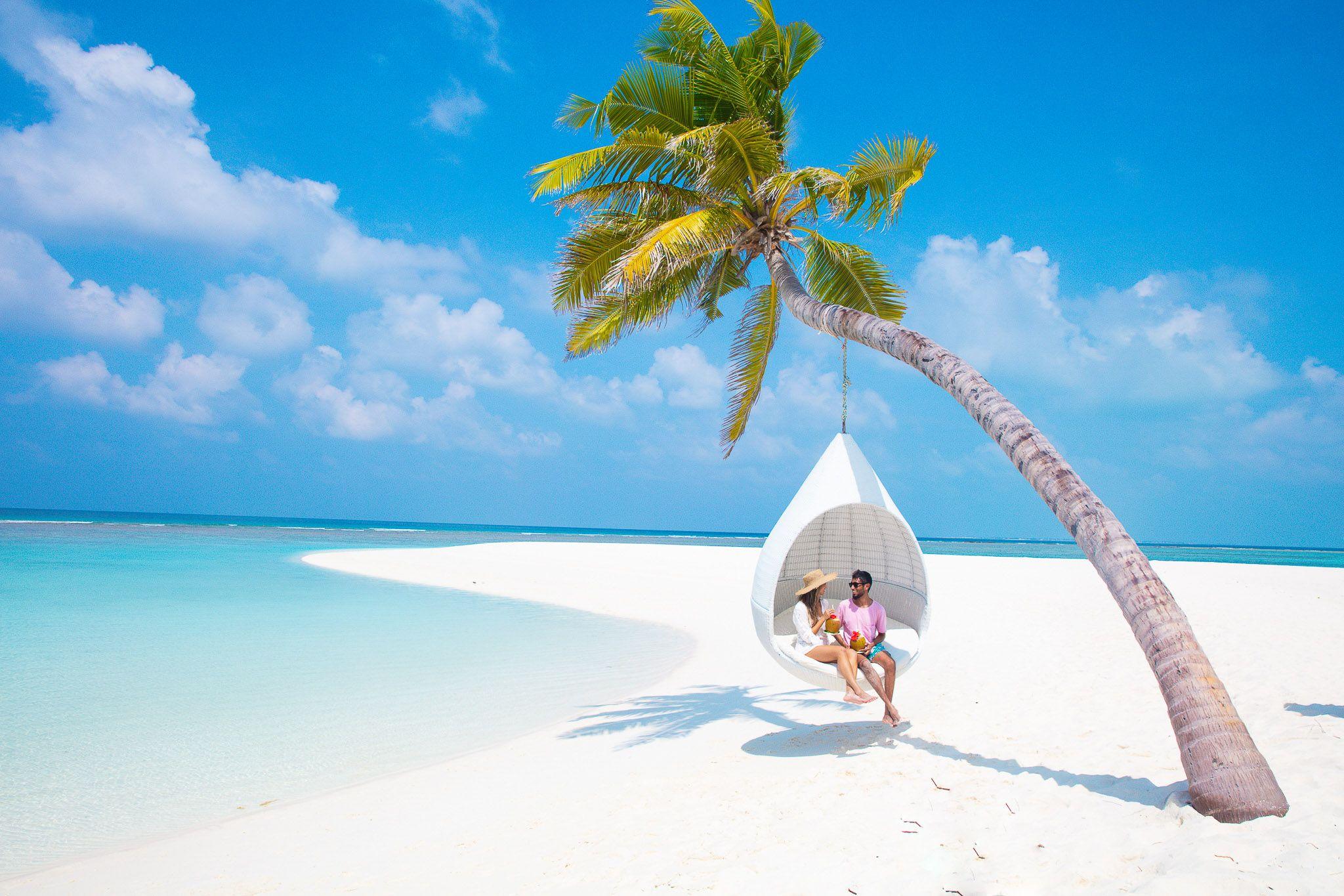 Hideaway Beach Resort & Spa - Romance - Activities - Beach Swing - Couple.jpg