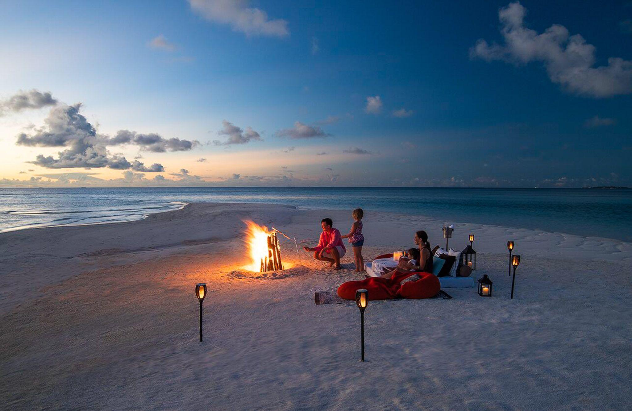The Residence Maldives Dhigurah - Excursions - Sandbank - Family Bonfire.jpg